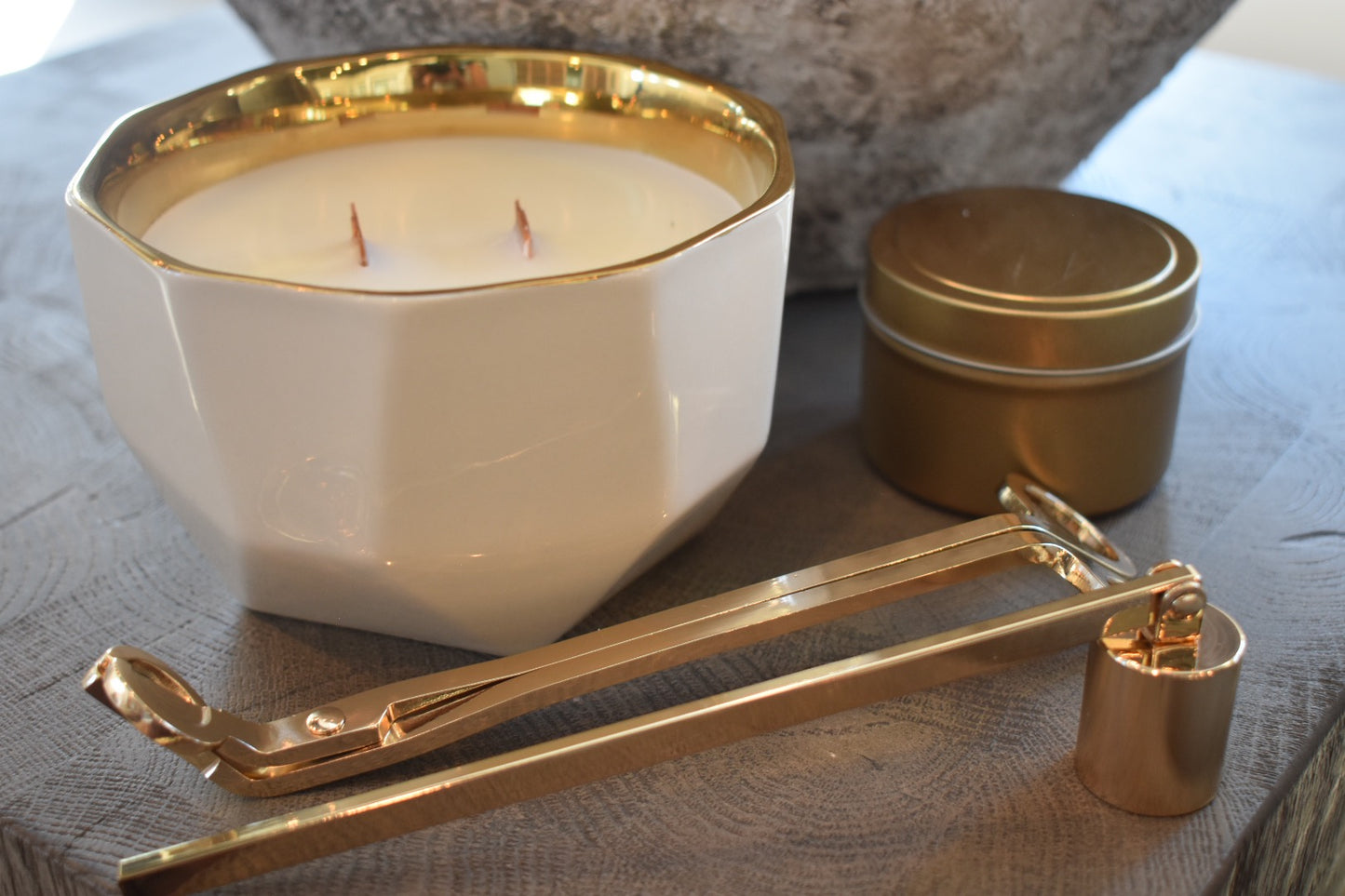 High Maintenance Gift Set featuring our full sized candle in a white asymmetric vessel. It also has our mini travel sized candle. Along with our candle accessories which includes a set of the candle wick snuffer in either black, gold, or silver